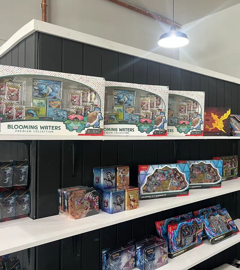 Pokémon premium collection boxes and tins on the shelf at Waterfront Card Shop